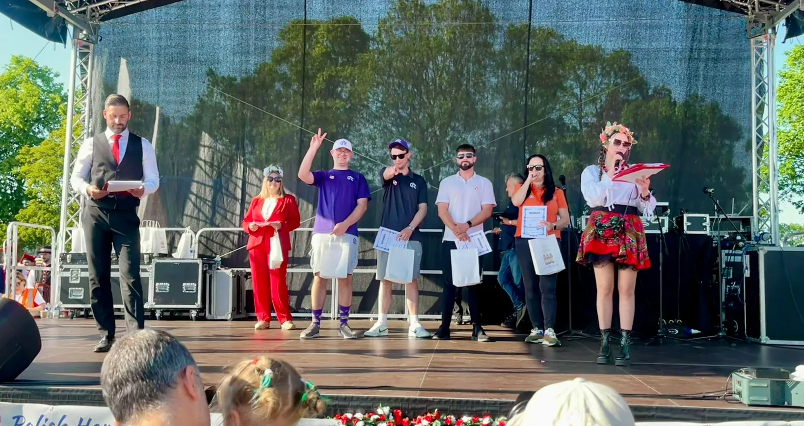 Patryk and Lukas from RAD Removals receiving sponsor awards with Malwina from Polish Clan at Polish Heritage Day 2025 in Hounslow, showcasing movers West London and storage Ealing.